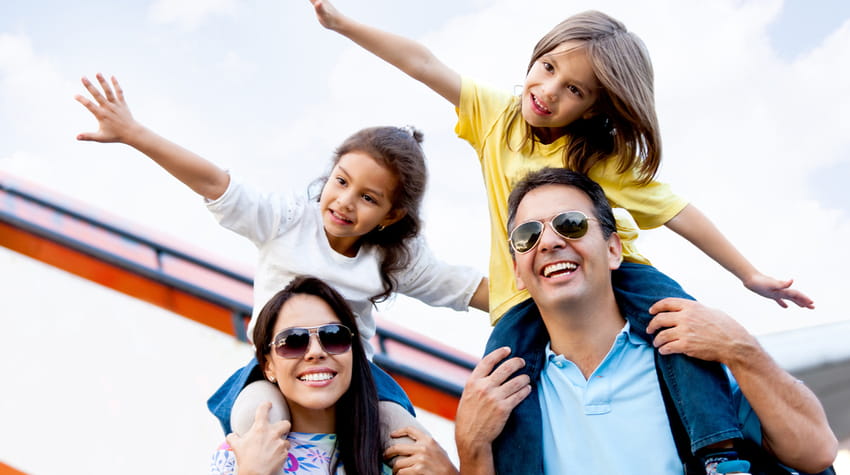 An excited family preps to board an airplane