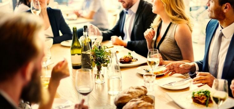 large group of people enjoying dinner together