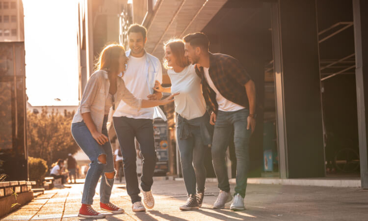 a group of friends chatting in a downtown area