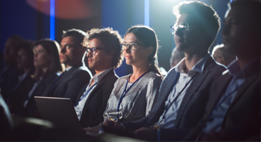 a crowd of people at a corporate event